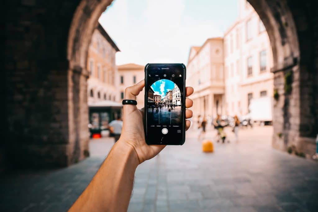 Instagram influencer taking a photo of a city view